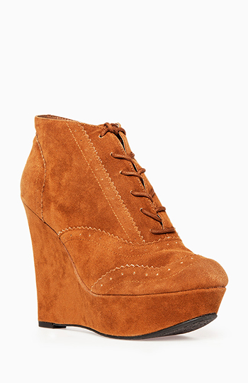 Spectator Wedge Booties in Rust | DAILYLOOK